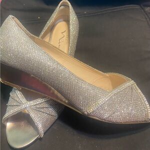 Sparkling, silver wedge with rhinestones.